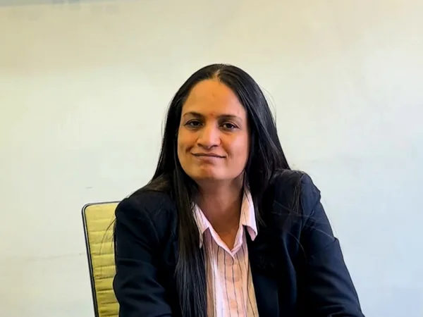 Pratigya Thakur at her desk, from the film