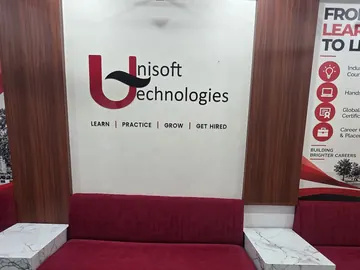 The Unisoft Technologies logo above the reception sofa